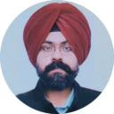 A centered portrait of a bearded man wearing glasses and a deep red turban, dressed in dark clothing against a pale blue-gray background; calm, formal tone.