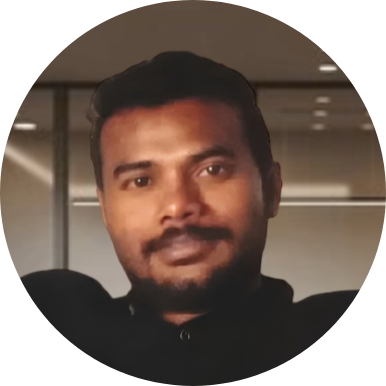Professional portrait of a man smiling, promoting a welcoming workplace culture on the Careers page.
